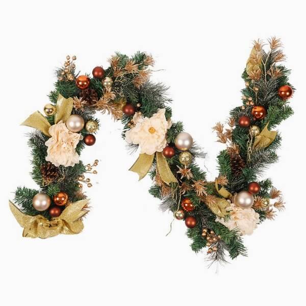 Christmas decorative garlands made of artificial ribbons and faux green leaves